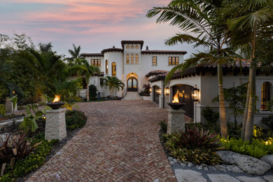 Design ideas for a classic two floor house exterior in Tampa with stone cladding.