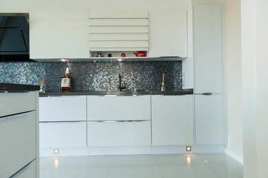 Example of a minimalist kitchen design in Other
