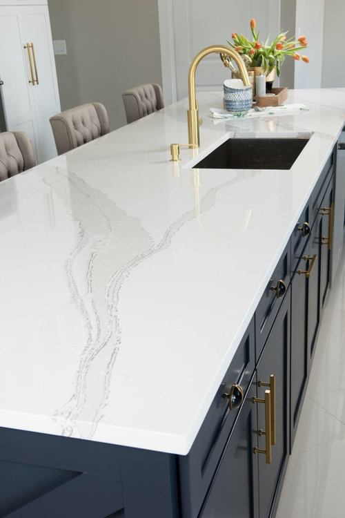 Black Sink In A Carrara Marble Kitchen Island