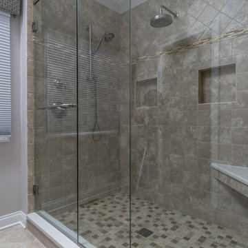 Full Length Glass Walls with Dual Rain Shower Fixtures and Built-In Shower Bench