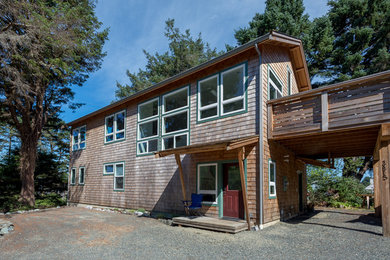 Mid-sized modern two-story wood and shingle exterior home idea in Seattle