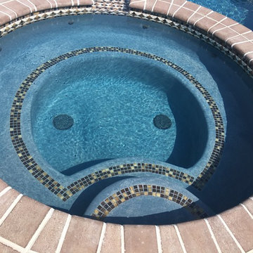 Lower Macungie large custom pool with spa, sunshelf, deck jets, and fountains