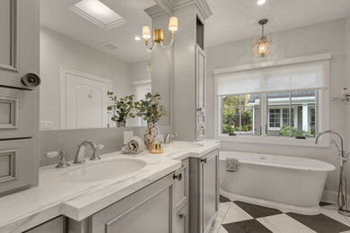 Large elegant master ceramic tile double-sink bathroom photo in San Francisco with recessed-panel cabinets, gray cabinets, quartzite countertops, multicolored countertops and a built-in vanity