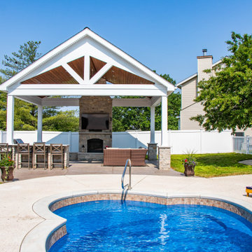 Open Gable Pool House with Fireplace and Grilling Area