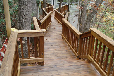 Large elegant backyard deck photo in Other with no cover