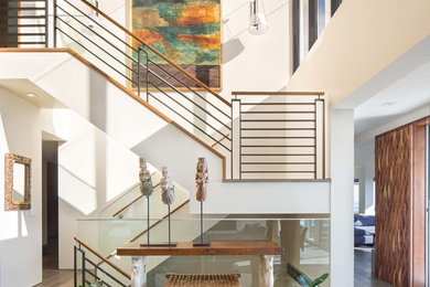 This is an example of a mid-sized contemporary u-shaped staircase in Orange County with mixed railing.