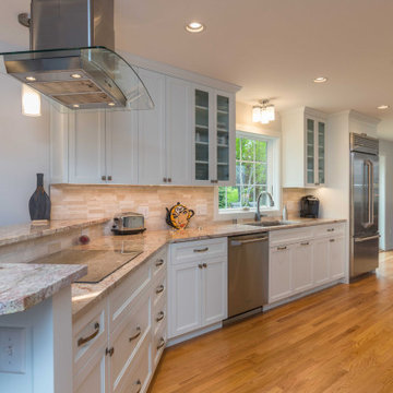 Modern Kitchen with White Flat Panel Shaker Cabinets & Natural Stone Backsplash