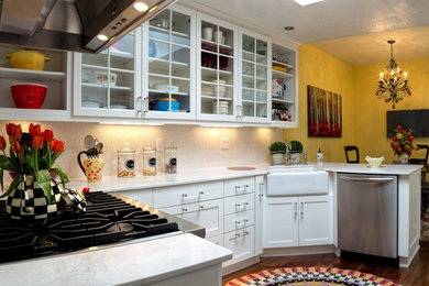 Mid-sized transitional u-shaped dark wood floor eat-in kitchen photo in Albuquerque with a farmhouse sink, shaker cabinets, white cabinets, quartzite countertops, white backsplash, stainless steel appliances and no island