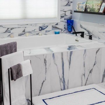 Bathroom remodeling in Columbia, MD with double vanity & marble bathtub