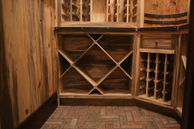 Wine cellar - rustic wine cellar idea in Denver