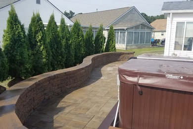 Inspiration for a small coastal full sun backyard concrete paver landscaping in New York.