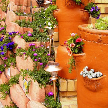 Front Yard with Artistic Driveway, Custom Sculptures, Planted Walls