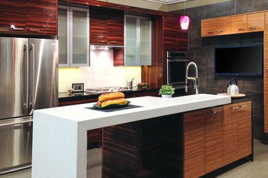 Photo of a mid-sized modern l-shaped eat-in kitchen in San Francisco with flat-panel cabinets, quartz benchtops, white splashback, porcelain splashback, stainless steel appliances, porcelain floors and with island.