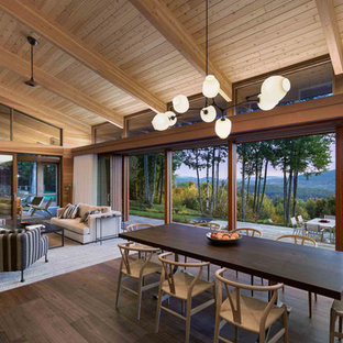 Great room - contemporary dark wood floor and brown floor great room idea in Boston with brown walls