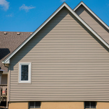 Seamless Polymer Siding in Mountain Clay w/ Energy Efficient Replacement Windows