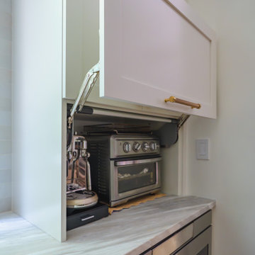 Transitional Kitchen Remodel with Quartzite Island and Brass Details