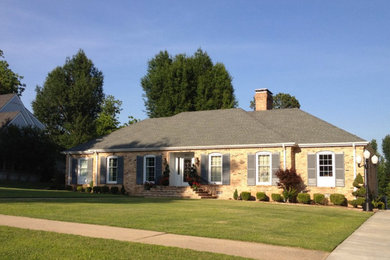 Inspiration for a large timeless brown two-story stone exterior home remodel in Chicago
