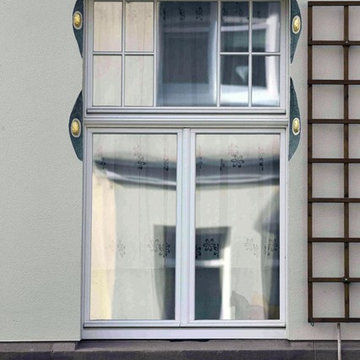 Abgerundete Fensterfaschen bilden ein Highlight der hochwertige Fassadensanierun