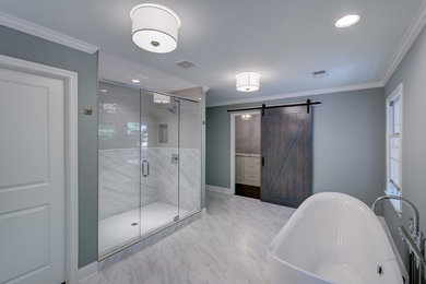 Bathroom - huge transitional master multicolored tile and porcelain tile porcelain tile and multicolored floor bathroom idea in Atlanta with shaker cabinets, white cabinets, a one-piece toilet, gray walls, a drop-in sink, marble countertops and a hinged shower door