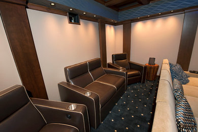 Photo of a mid-sized traditional home theatre in New York.