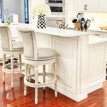 Ivory White Kitchen With Marble Look Quartz Counters and Splash