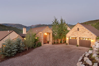 Inspiration for a timeless two-story stone exterior home remodel in Other