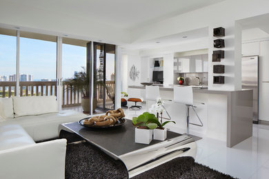 Inspiration for a large modern open concept ceramic tile living room remodel in Miami with white walls and no tv