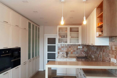 Inspiration for a mid-sized transitional galley eat-in kitchen in Moscow with recessed-panel cabinets, white cabinets, laminate benchtops, ceramic splashback and beige benchtop.