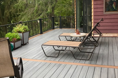 Huge minimalist backyard deck photo in Minneapolis with no cover