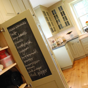 Blackboard inside pantry cabinet for tracking grocery needs.
