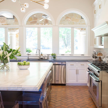 Lake Austin Kitchen with White Cabinets, Black Island