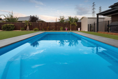 Design ideas for a mid-sized modern backyard rectangular lap pool in Melbourne.