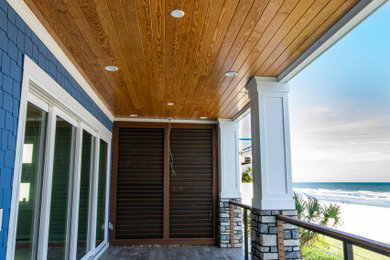 Inspiration for a mid-sized coastal home design remodel in Other