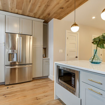 Kitchen Remodeled With White Countertops, Extra Cooking Space & Large Cabinets