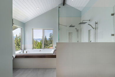 Bathroom - mid-sized coastal master white tile and ceramic tile ceramic tile, gray floor, double-sink and shiplap ceiling bathroom idea in Other with shaker cabinets, white cabinets, a one-piece toilet, blue walls, a vessel sink, quartz countertops, a hinged shower door, white countertops and a built-in vanity