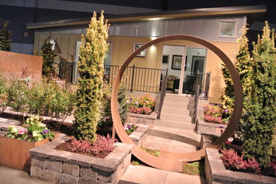Example of a small minimalist one-story metal exterior home design in Portland