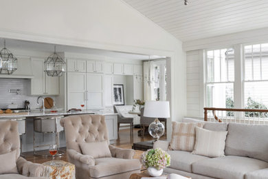 Inspiration for a large transitional open concept medium tone wood floor, exposed beam and shiplap wall family room remodel in Atlanta with white walls, a standard fireplace, a stone fireplace and a concealed tv