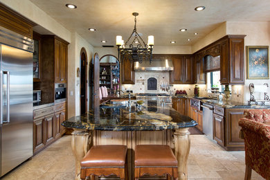 Inspiration for a kitchen remodel in San Diego with medium tone wood cabinets, granite countertops and stainless steel appliances