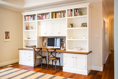 Photo of a traditional home office in Melbourne with a built-in desk.