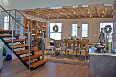 Mid-sized trendy medium tone wood floor and brown floor great room photo in Orange County with white walls and no fireplace