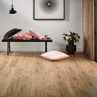 Esempio di un grande ingresso design con pareti grigie e pavimento in vinile