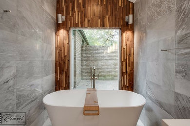 Mid-sized mid-century modern master gray tile and marble tile marble floor and gray floor bathroom photo in Dallas with flat-panel cabinets, medium tone wood cabinets, gray walls, an undermount sink, quartzite countertops and white countertops