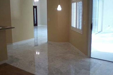 Example of a mid-sized marble floor hallway design in Other with beige walls