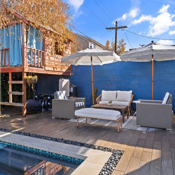 Modern black pebble pool & spa | small backyard