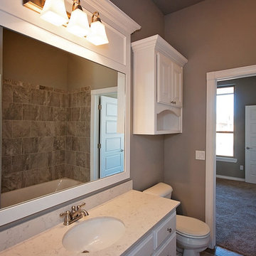 Guest Bathroom with White Cabinets and Mirror Trim
