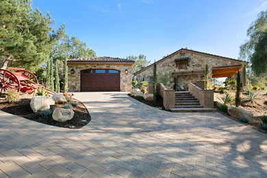 Tuscan home design photo in San Diego