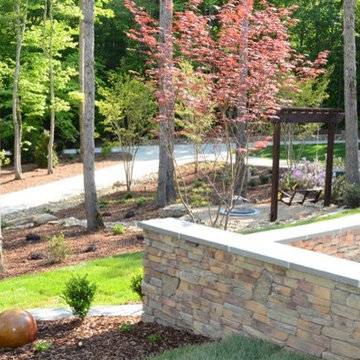 Stone wall added for parking and front yard landscape.