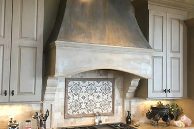 Transitional kitchen photo in Atlanta with raised-panel cabinets, gray cabinets, granite countertops, beige backsplash and an island