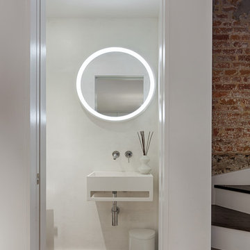 Modern Powder Room with Circular Mirror