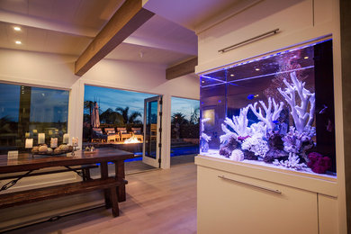 Eat-in kitchen - mid-sized coastal galley eat-in kitchen idea in Los Angeles with an island